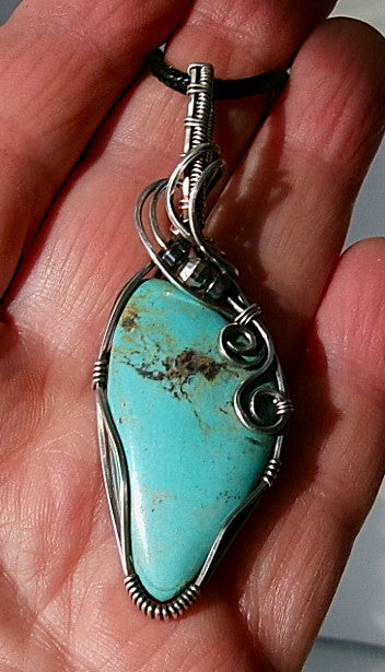 Turquoise gemstone sterling silver wire wrapped crystal pendant with hematite and sterling silver accent beads