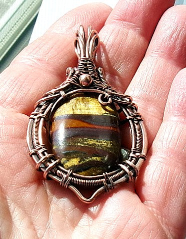 Tiger iron gemstone copper wire wrapped crystal pendant with copper accent bead