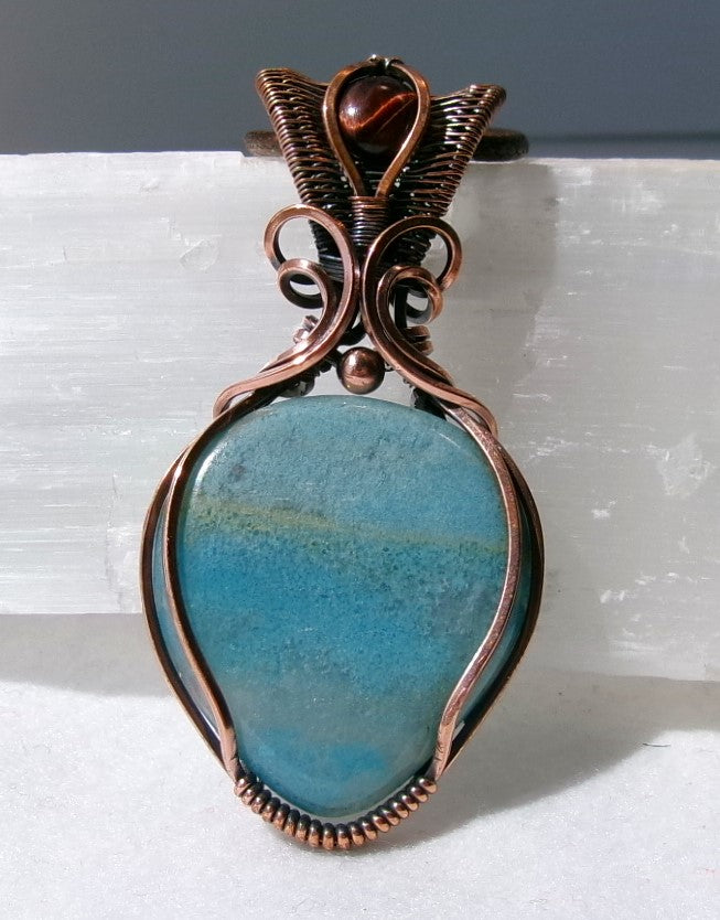 Trolleite gemstone copper wire wrapped crystal pendant with red tiger’s eye gemstone set in a woven bail with copper accent bead