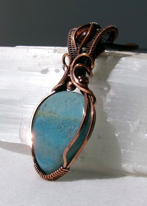 Trolleite gemstone copper wire wrapped crystal pendant with red tiger’s eye gemstone set in a woven bail with copper accent bead