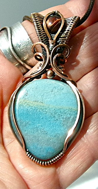 Trolleite gemstone copper wire wrapped crystal pendant with red tiger’s eye gemstone set in a woven bail with copper accent bead
