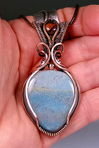 Trolleite gemstone copper wire wrapped crystal pendant with red tiger’s eye gemstone set in a woven bail with copper accent bead