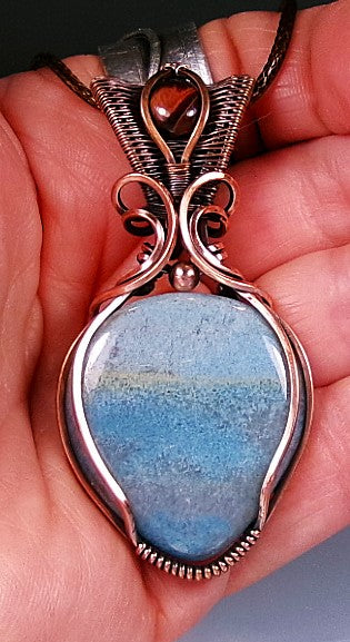 Trolleite gemstone copper wire wrapped crystal pendant with red tiger’s eye gemstone set in a woven bail with copper accent bead